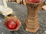 two vases that are sitting on a table