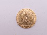 l'image d'une pièce d'or ornée d'un coq