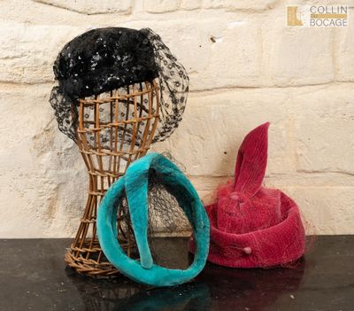 two hats that are sitting next to each other on a table
