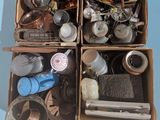 two boxes filled with assorted items sitting on a blue surface