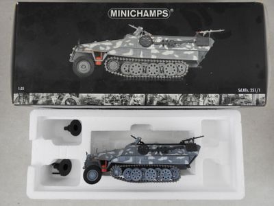 a box with a toy tank in it on a table