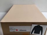 an open box with a picture of a man ' s shirt on it