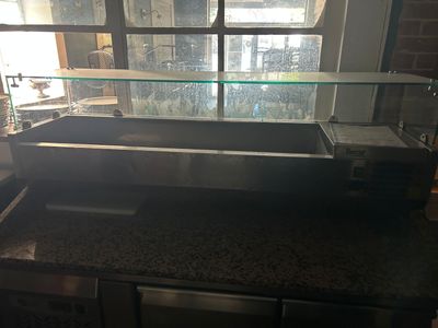 an image of a counter top with a glass display case