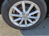 a close up of a tire on a car ' s rim