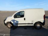 a white van that is parked in a parking lot