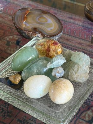 a glass plate with rocks and stones on a table
