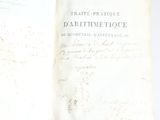 a book open on a table with writing on it