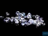 a bunch of diamonds on a black surface
