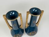 two vases that are sitting next to each other