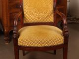 a chair with a yellow upholstered upholstered seat