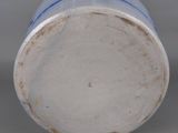 a close up of a blue and white vase