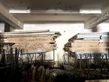 many chairs and tables in a room with a lot of wood