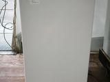 an image of a white refrigerator in a room