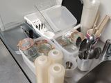 a sink that has a lot of utensils in it
