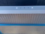 a white and blue stove top oven with a blue trim