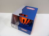 a helmet that is in a box on a table