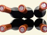 six bottles of wine sitting on top of each other