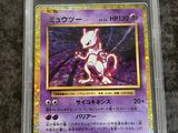 a close up of a pokemon card in a plastic case