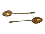 pair of antique brass serving spoons