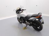a picture of a motorcycle parked in a white room