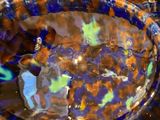 a bowl with a blue and orange design on it