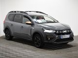 the grey suv is parked in a room with a checkered floor