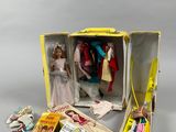 a doll in a box with other dolls inside of it