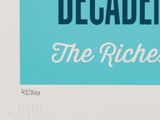 a blue and white poster with the words decade the richies
