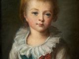 portrait of a young boy in a blue and white dress