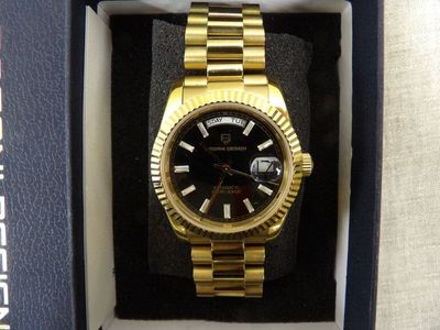 a watch that is in a box on the table