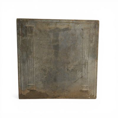 an old metal plate with a design on it
