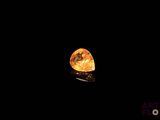 a close up of a rock in the dark with a black background