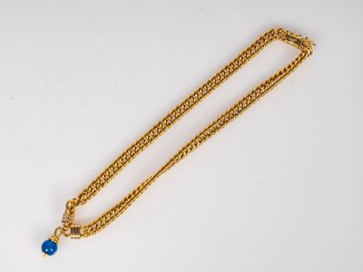 CHRISTOFLE. Collier en or à maille gourmette centré d'un pendentif bou - Photo 1