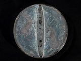 a silver coin with a picture of a man and a woman on it