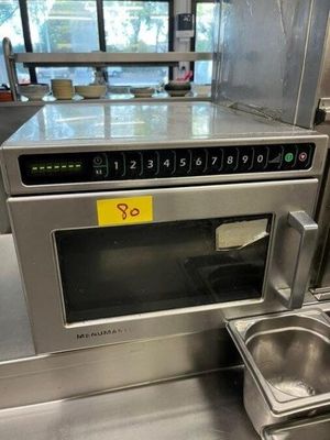 a microwave that is sitting on a counter in a kitchen