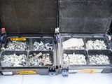 many different types of screws and nuts in this case