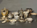 a lot of silver items that are on a table