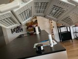 a ceiling light that is hanging over a kitchen counter