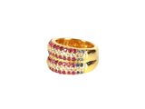 a close up of a gold ring with multi colored stones
