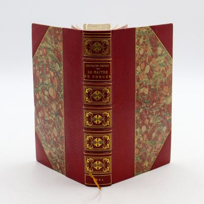 a red book with gold trim on it