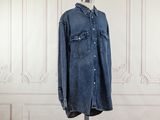 an image of a denim shirt on a mannequin mannequin stand