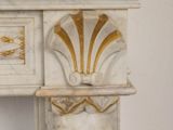 a white table with a gold decoration on it