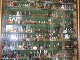 a picture of a man standing in front of a large display case