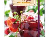 a close up of a book with strawberries and jam on it