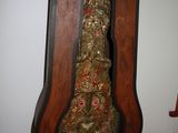 a grandfather clock that is hanging on the wall