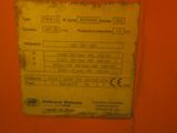 a label on the back of a machine that is on the wall