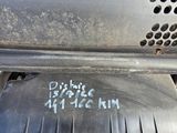 a close up of a metal grill with a sticker on it