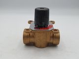 a close up of a brass ball valve on a white surface