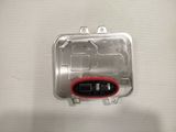 a close up of a metal box with a red button on it