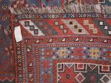 a close up of a rug with a tag on it